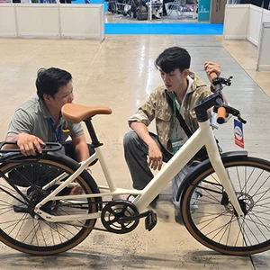 Customers try out our new electric bicycle products at the Vietnam exhibition